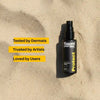 Black spray bottle labeled ' flaunt your INK' on a beige background with text about dermatologists, artists, and users.