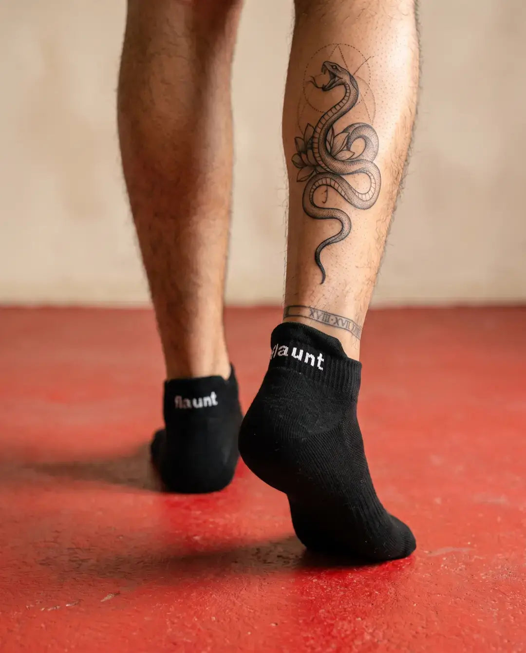 Flaunt Socks worn, walking away, red floor