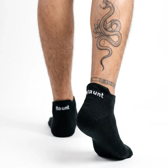 Flaunt Socks worn, walking away, white background